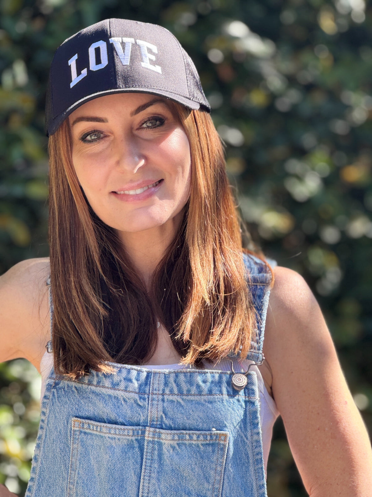 LOVE COLLEGIATE EMBROIDERED TRUCKER HAT (Black w/ White)