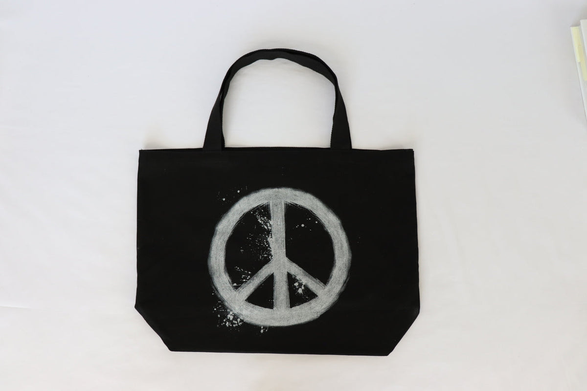 PEACE SIGN SPLATTER BLACK CANVAS TOTE. Main image