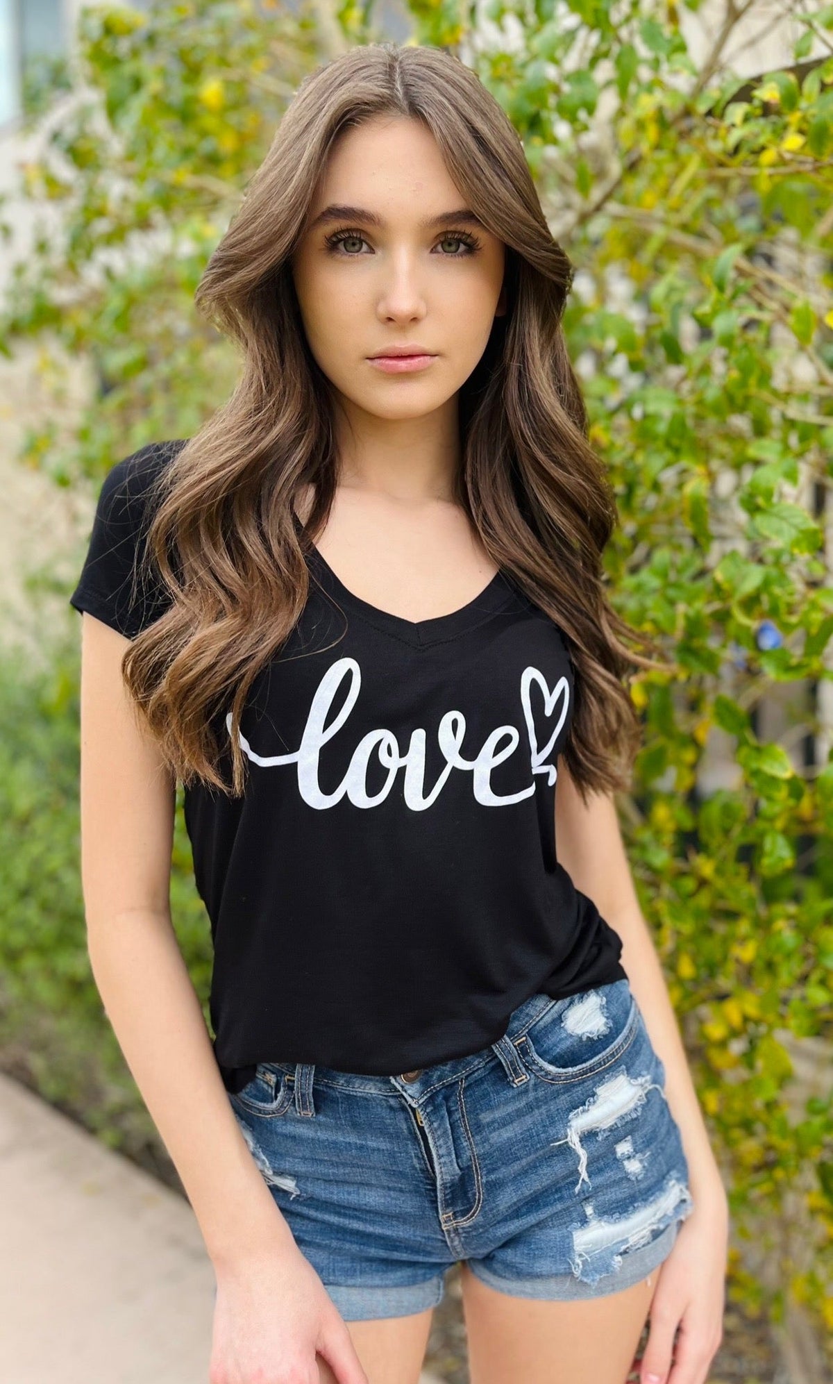 LOVE CURSIVE S/S V NECK with SCATTERED  HEARTS on back. (Black)